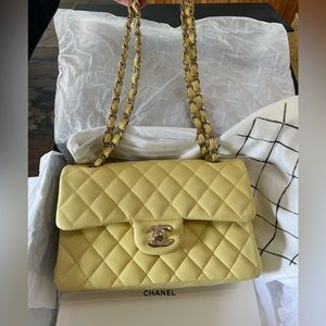 Small classic Chanel handbag in light yellow